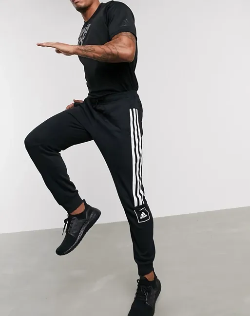 adidas skinny 3 stripe joggers in black